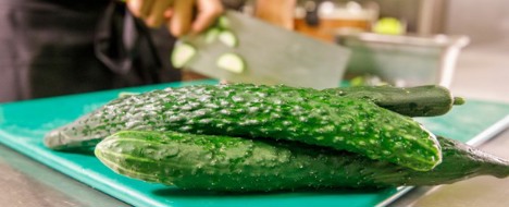 Irresistible Wokcue Cucumbers on a cutting board