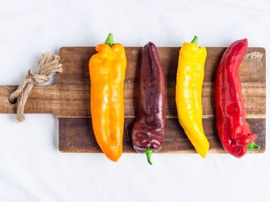 Sweet Palermo Pepper varieties on a wooden plate